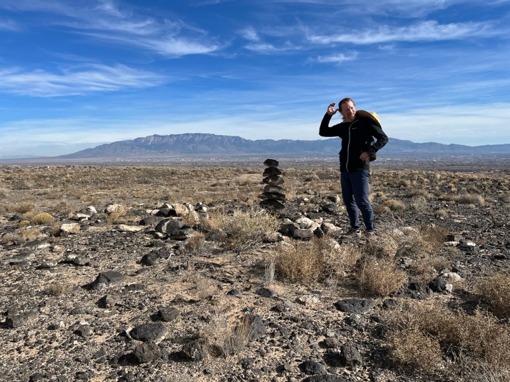Picture of Bram at the Petroglyphs National Monument in Albuquerque, New Mexico. Photo credit: Christopher Valles, 2023.